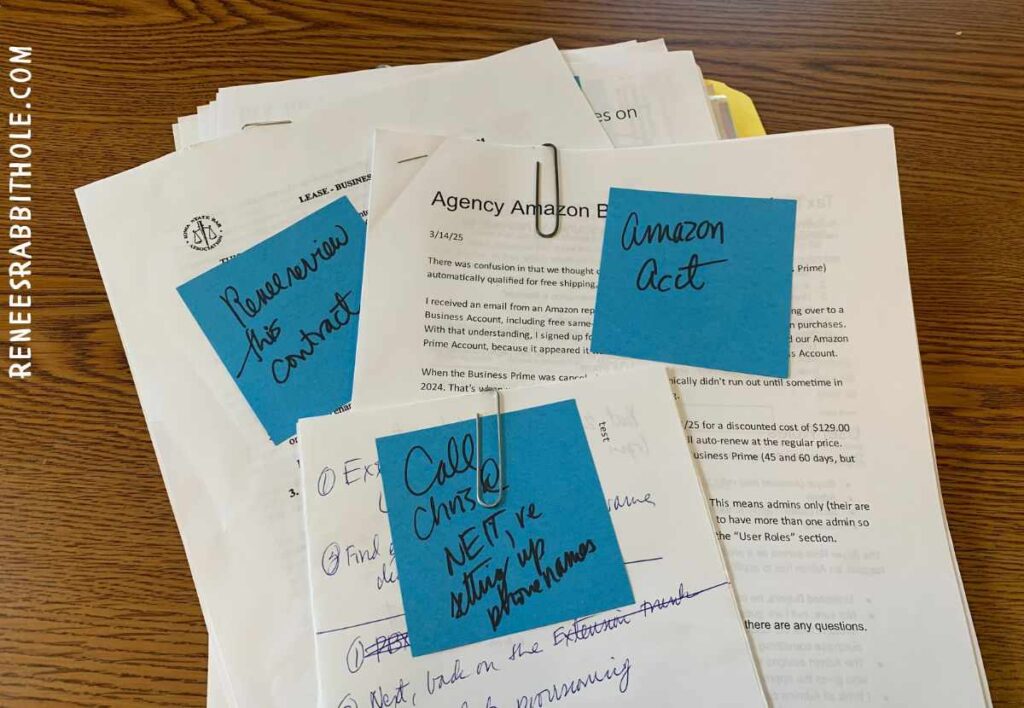 Post-it notes serve as a quick visual summary of a stack of papers.